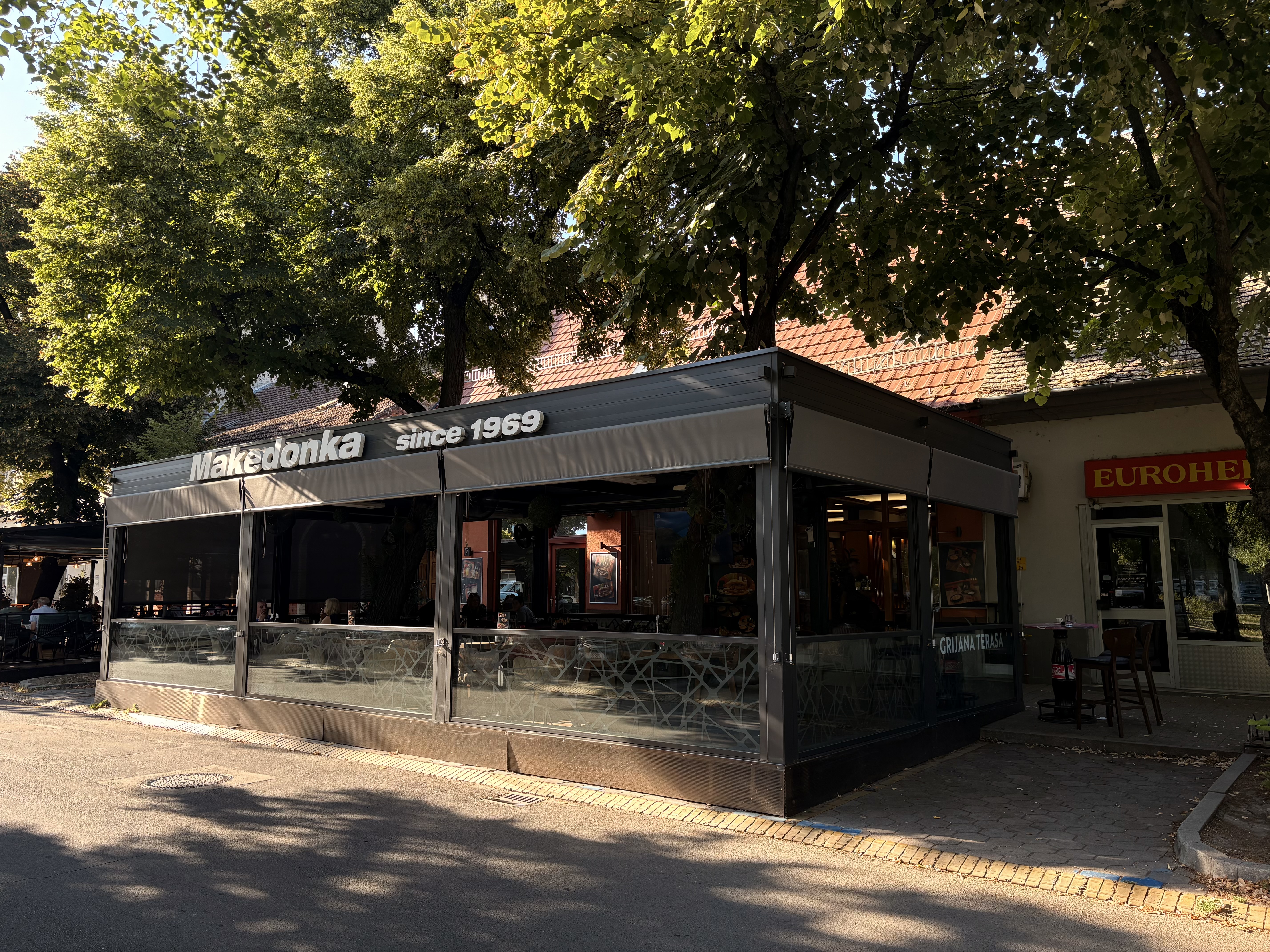 Pečenjarnica Makedonka storefront with 'since 1969' signage and tree canopy